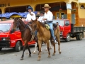 Cowboys ride through the streets of Las Tablas, Panama.