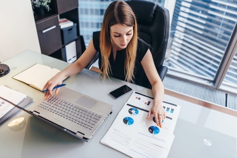 Businesswoman reading financial report