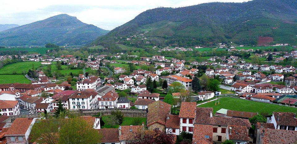 Many white and red houses dot the Basque countryside