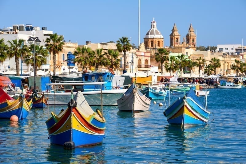 Marxaslokk harbor with traditional maltese eyed boats, Malta. humidity overseas