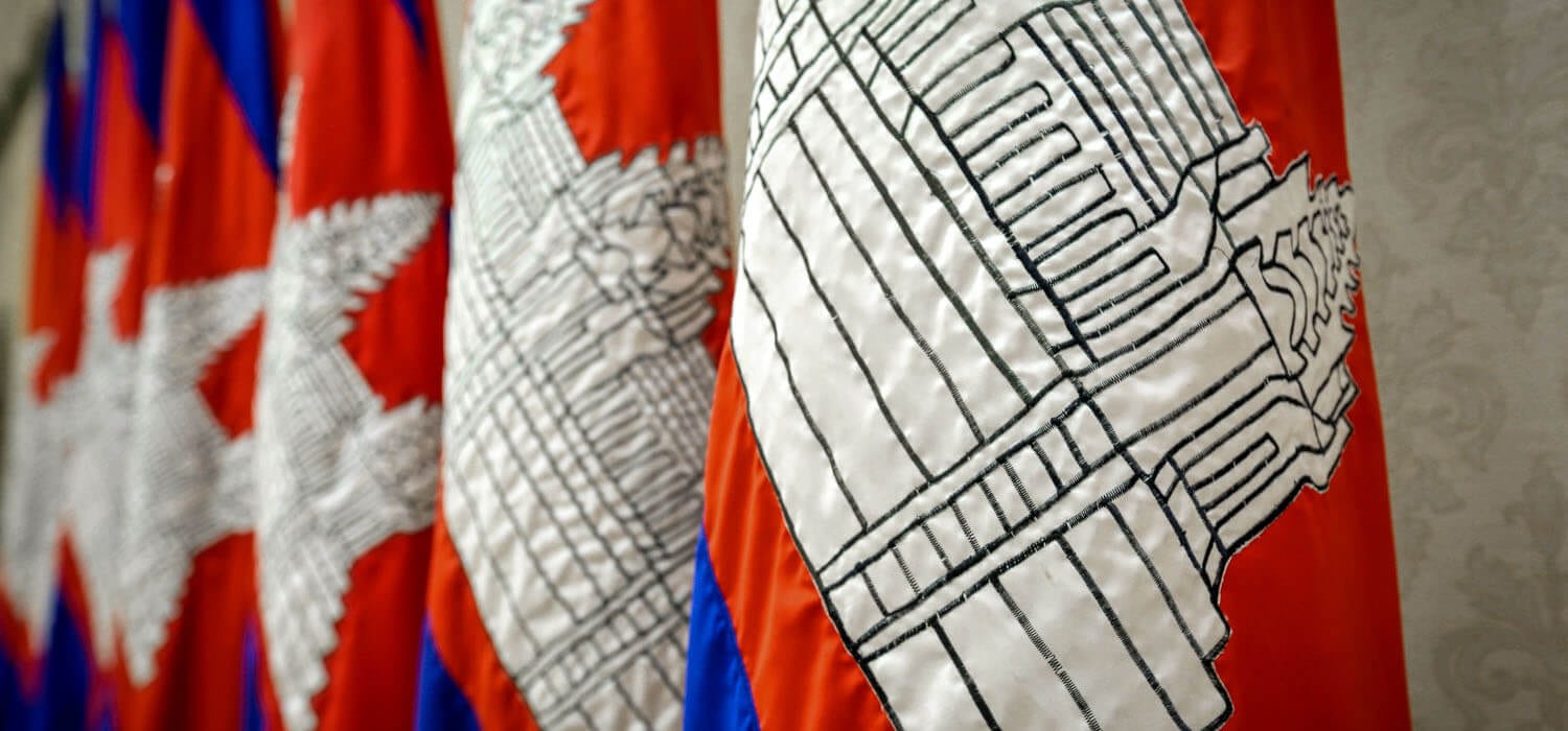 Close up of a group of red white and blue Cambodian flags. cambodia visa