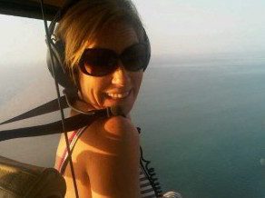 Liz Larroquette in a helicopter