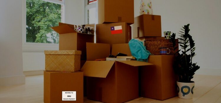 A group of boxes sitting in a living room getting ready for a move to Chile.