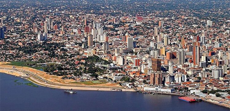 aerial view of the large city of asuncion. map of paraguay