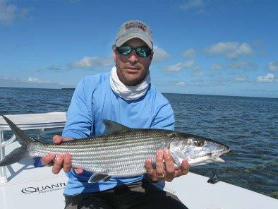 A man holding a bone fish