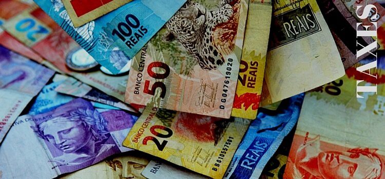 A stack of Brazilian reals used for paying taxes in Brazil