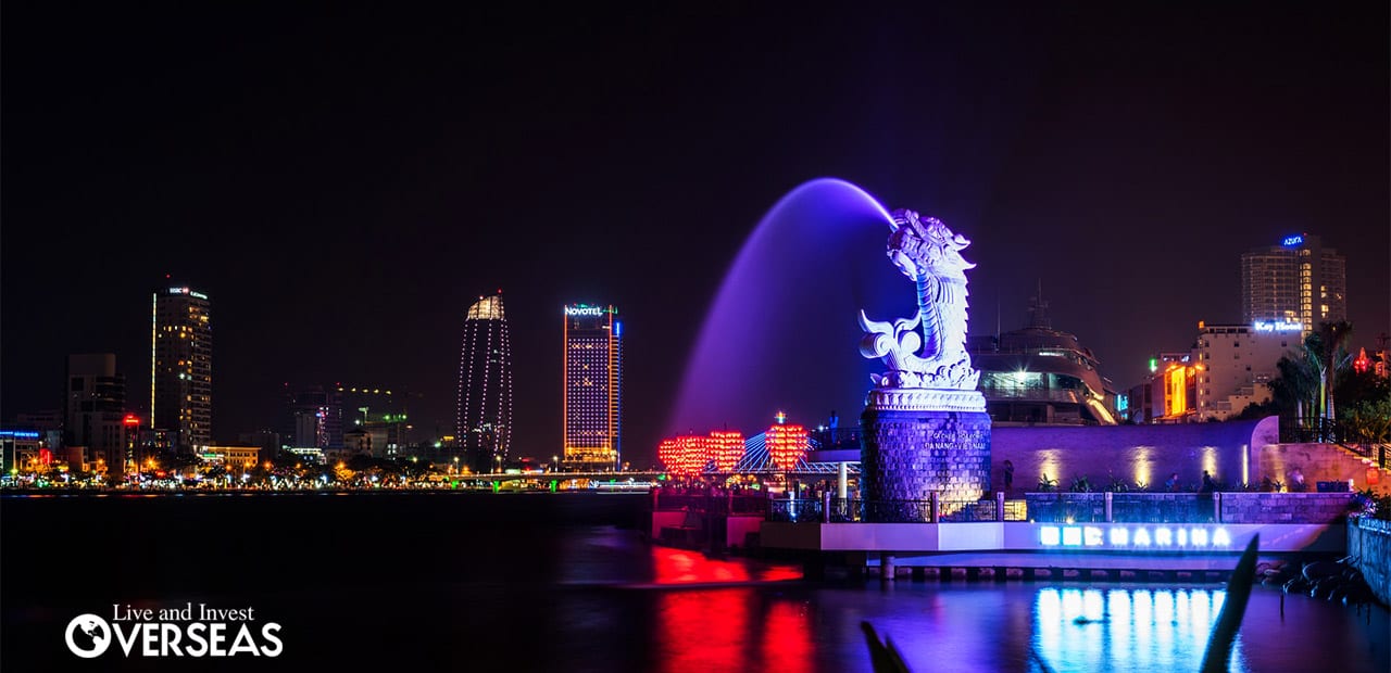 the Da Nang skyline at night lit up in bright colors