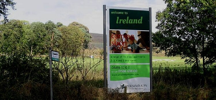 Sign for a real estate investment in Ireland alongside the road.