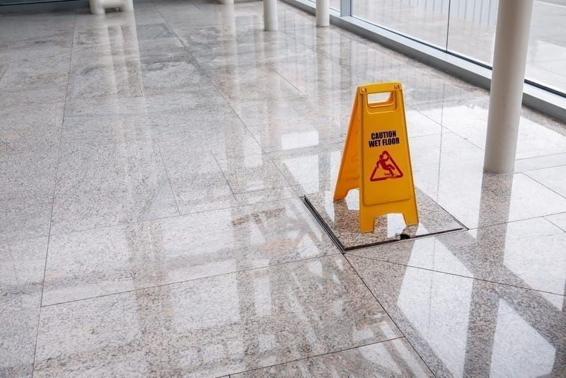 Wet floor sign on lobby.