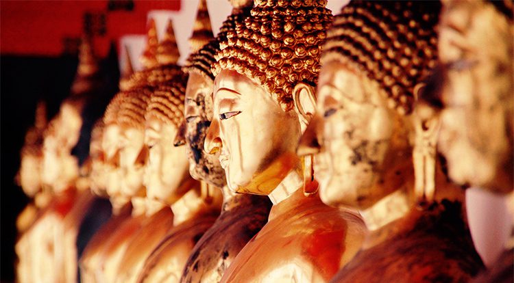close up of buddhist statues in Thailnd