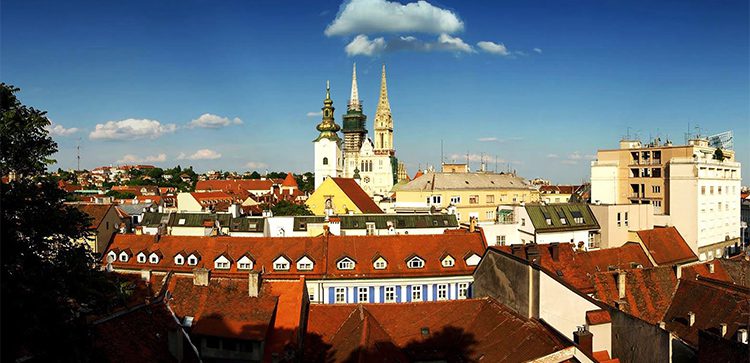 rooftops of Croatia with a steepled building poking through