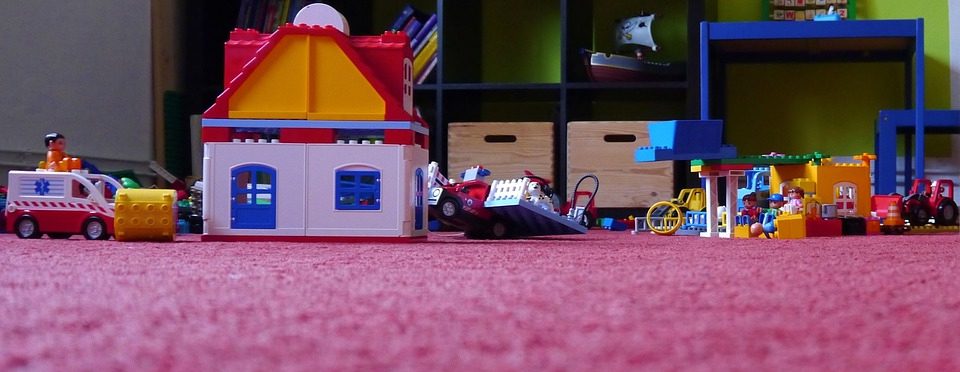 children's toys on a pink rug