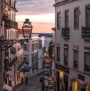 Cobblestone Street between apartment buildings in Lisbon