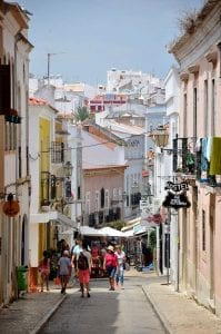 People walking down an alley in the Algarve