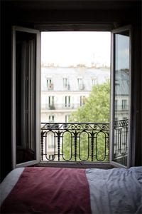 An open window in a Paris bedroom