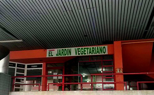 an orange facade of a vegetarian restaurant in Panama