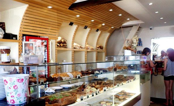 Customers buy pastries from a local french pastry shop in Las Terrenas