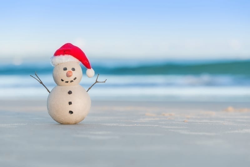 Sandy Snowman on a beautiful sand beach.