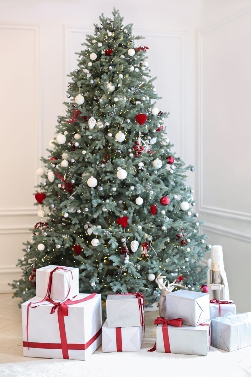 Living room interior with decorated Christmas tree. 