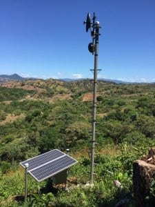 Solar Powered Internet Tower at Los Islotes, Panama. Countryside Hills And Mountains In Background