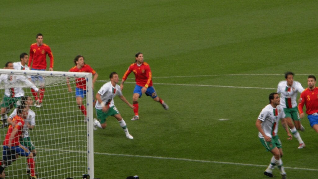 spain vs portugal international. ramos and puyol run for a header