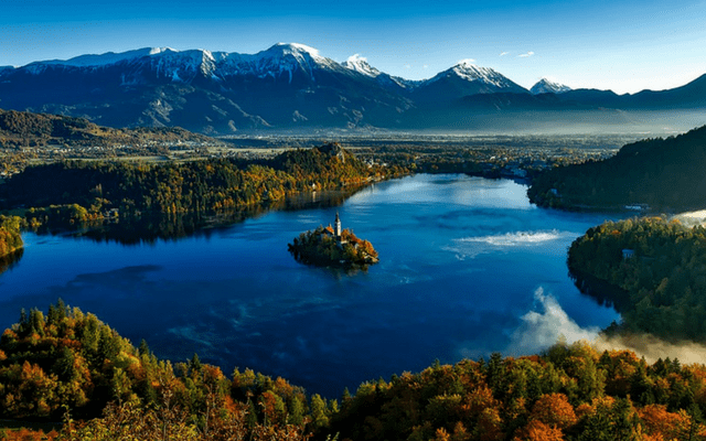 A lake in Slovenia near to Bled. Wild countryside with mountains in the distance