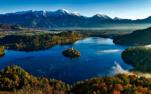 A lake in Slovenia near to Bled. Wild countryside with mountains in the distance