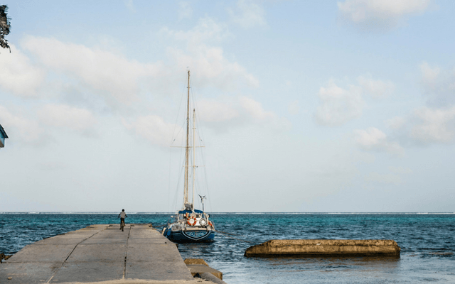 Yacht by jetty in Belize
