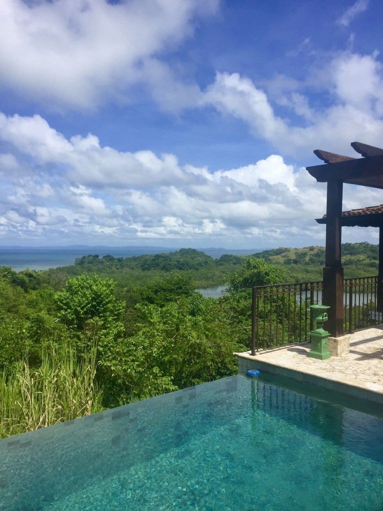 swimming pool overlooking valley and ocean