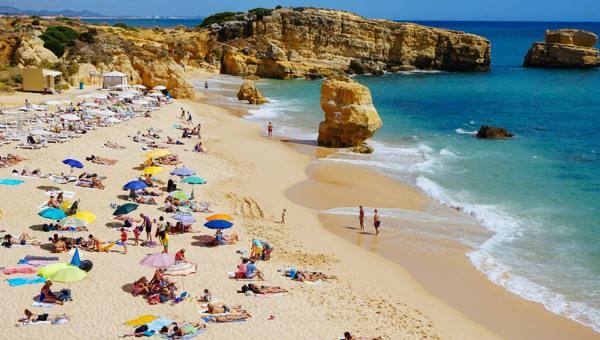 praia de sao rafael beach sunbathing and sun umbrellas