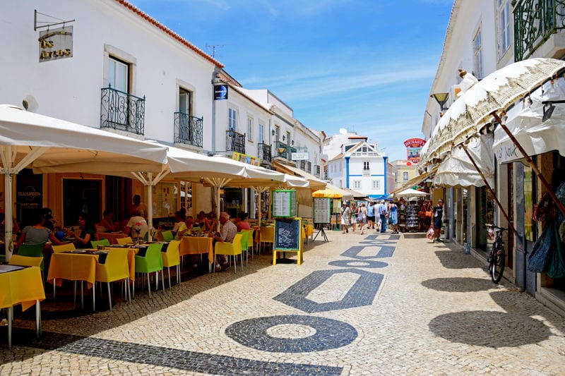 People sitting outside in a cafe. Lagos, Portugal