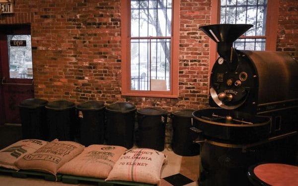 Coffee sacks and coffee roaster. World's best coffee tours