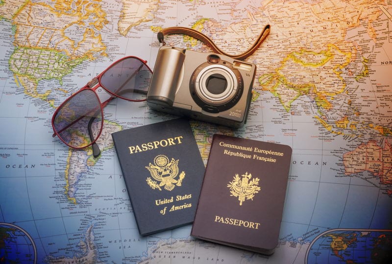 france and usa passport on map