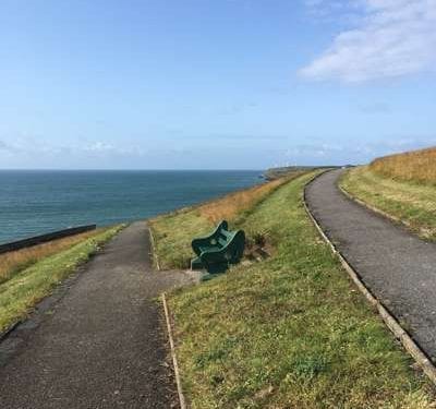 A bench with great views the bay near Tramore, Ireland