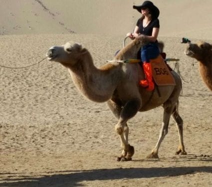 Kathleen on a camel in China