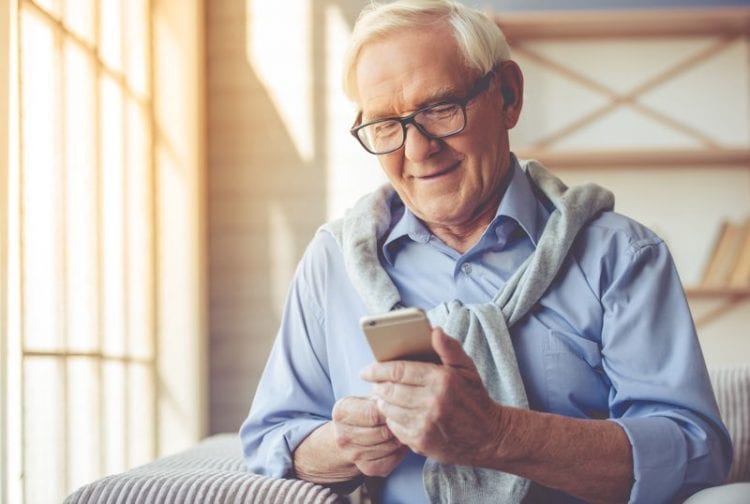 A senior man making a phone call