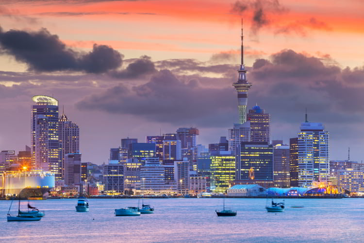 Cityscape image of Auckland skyline, New Zealand during sunset.