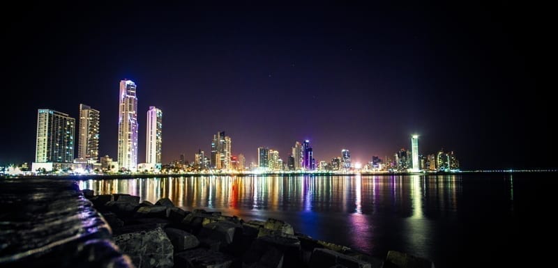 Panama City at night. Reflection of the lights in the ocean. moving to panama