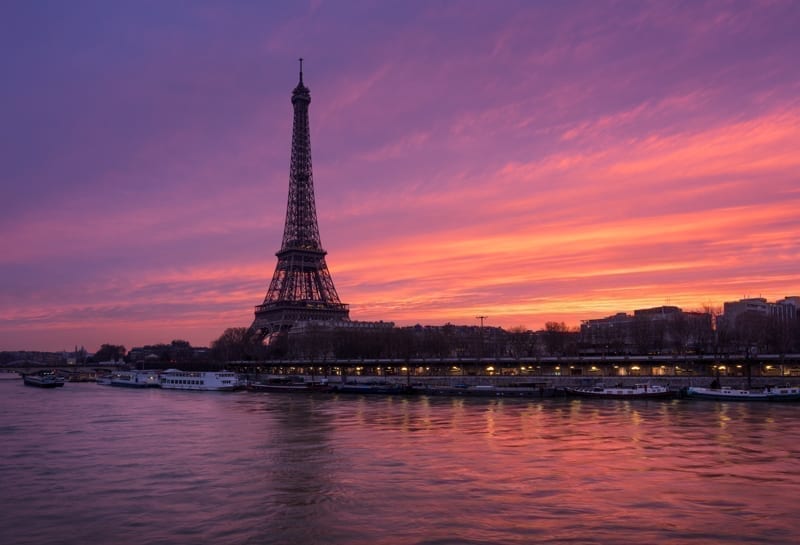 Fiery sunrise on the Eiffel Tower and Seine River, Paris.