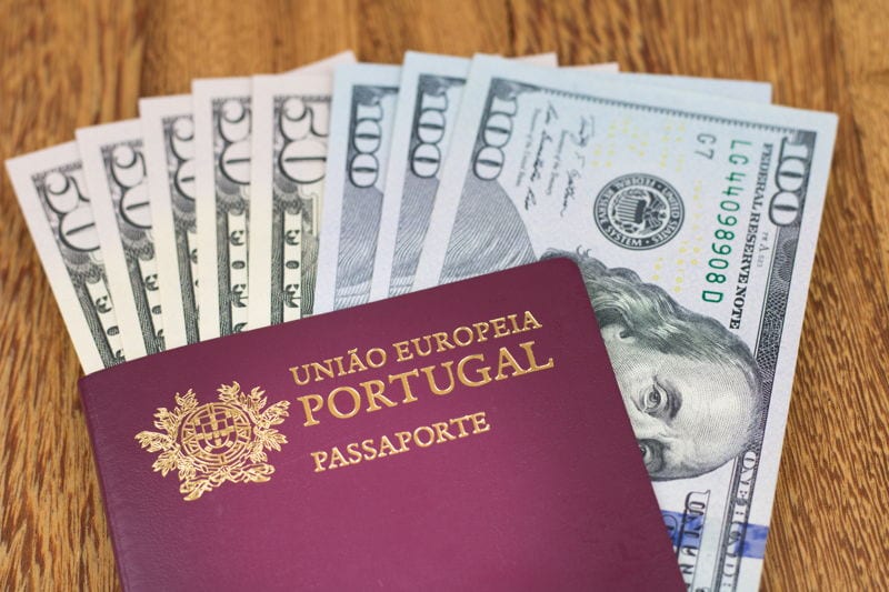 A Portugal passport with US dollars