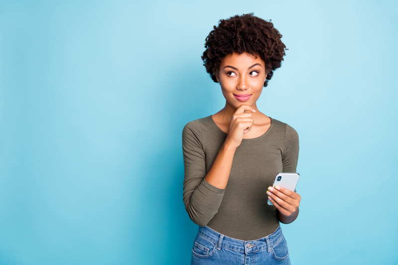 woman thinking about cell phone