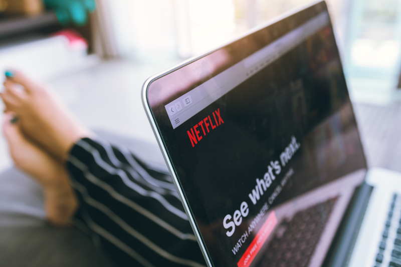 watching netflix on a laptop and relaxing