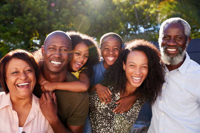 a family with different generations smiling