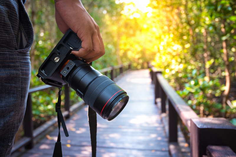 man holding professional camera