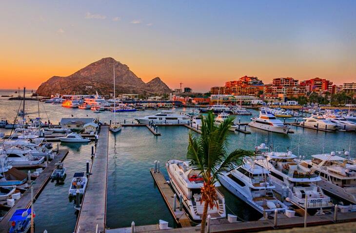 A marina with many yachts in Mexico at sunset