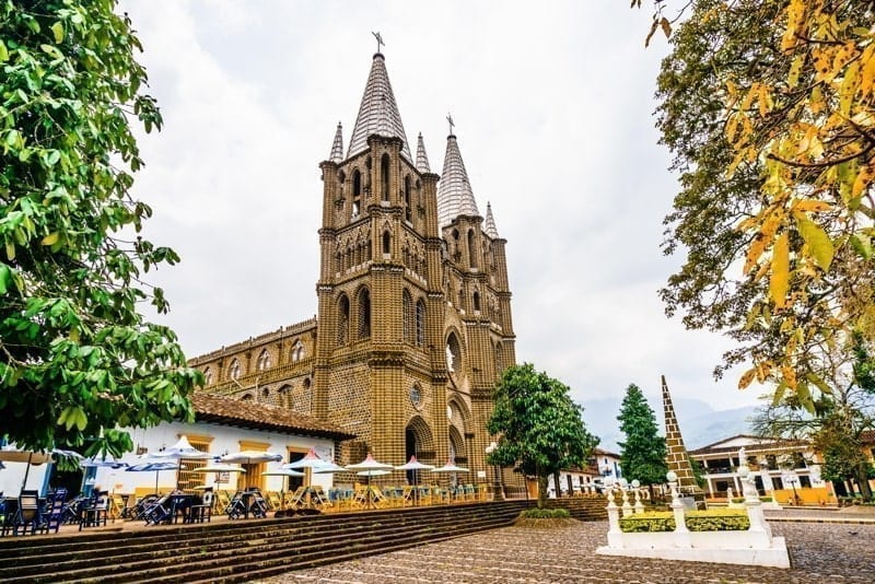 View of church and main square in colonial city El Jardin, Medellin, live in Colombia
