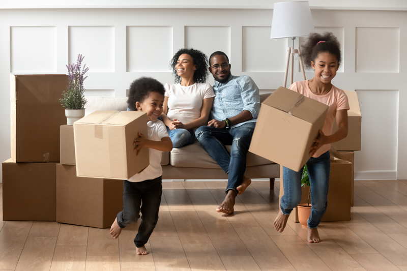 a family moving into a new house. moving overseas with kids