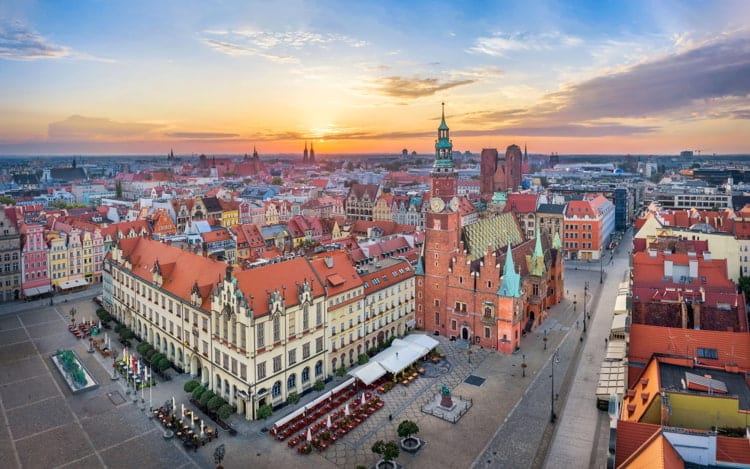 Aerial view of Rynek square, Poland with historic gothic Town Hall on sunrise.