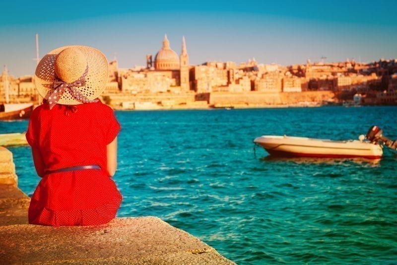 Tourist looking at Malta capital in evening