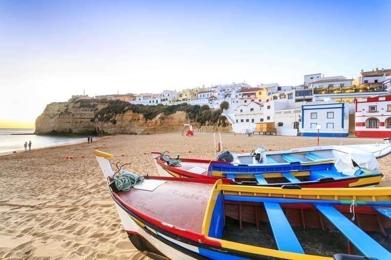 Beautiful beach with boats in Carvoeiro, Algarve, Portugal.